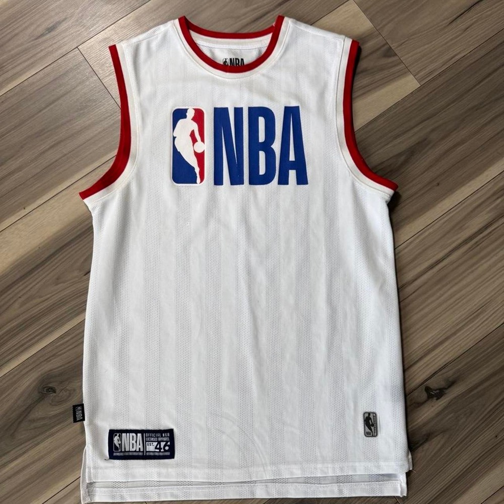 NBA white basketball jersey with bold red trim and classic NBA logo detail